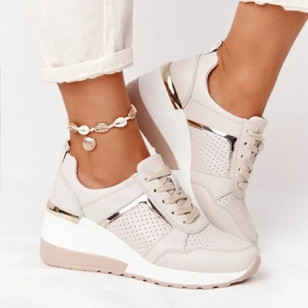 Women's platform trainers with lace-up fronts, perforated panels and metallic trims