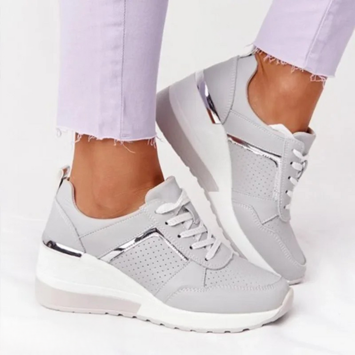 Women's platform trainers with lace-up fronts, perforated panels and metallic trims