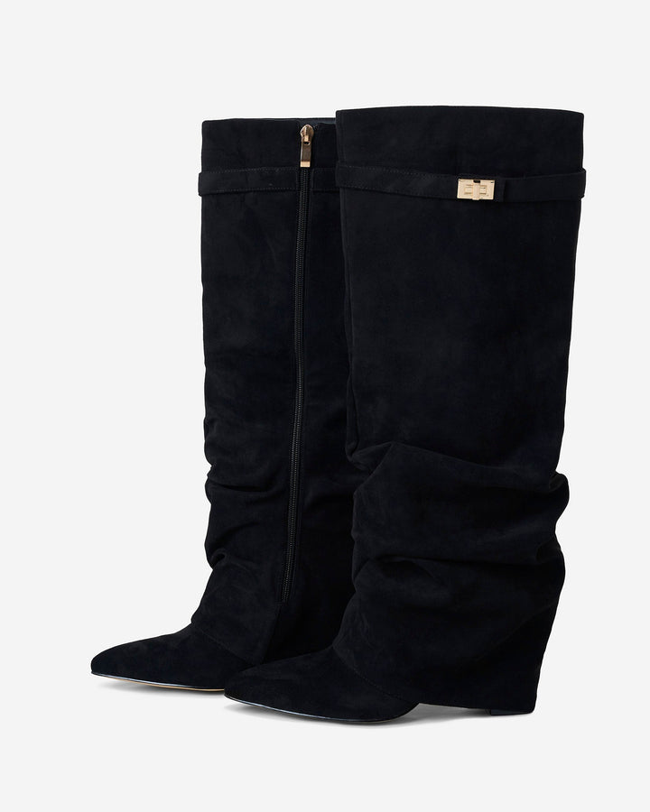 Women's black slouchy knee-high boots with pointed toes and buckle straps