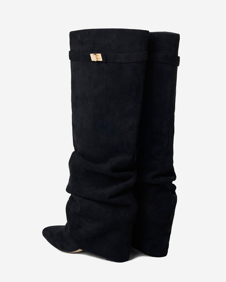 Women's black slouchy knee-high boots with pointed toes and buckle straps
