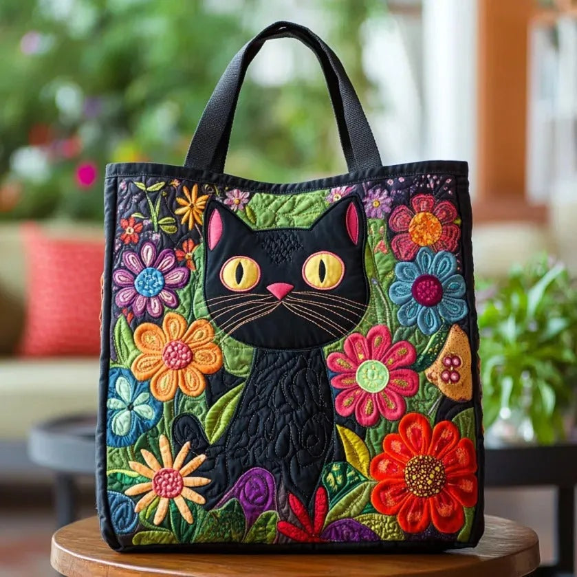 Women's quilted tote bag with illustrated floral and animal designs