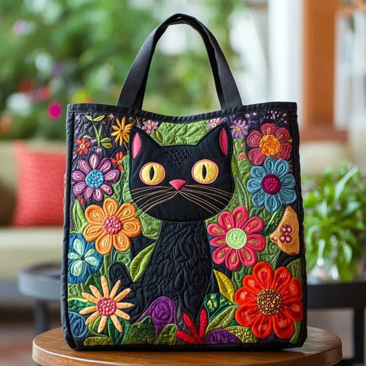 Women's quilted tote bag with illustrated floral and animal designs