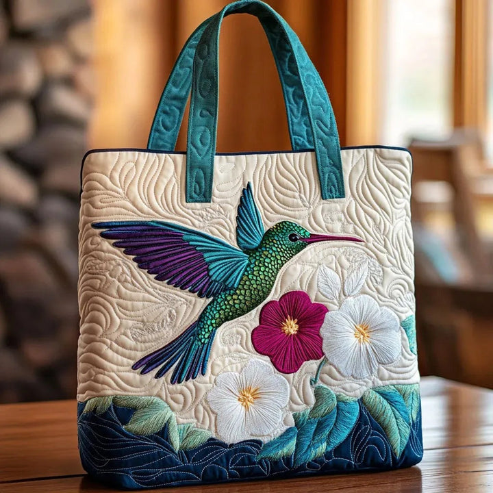 Women's quilted tote bag with illustrated floral and animal designs