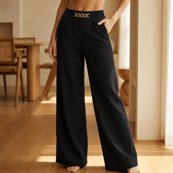 Women's wide leg trousers with elastic high waist, side pockets and gold chain accent