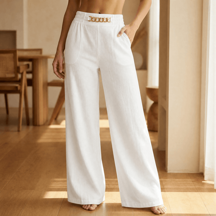 Women's wide leg trousers with elastic high waist, side pockets and gold chain accent