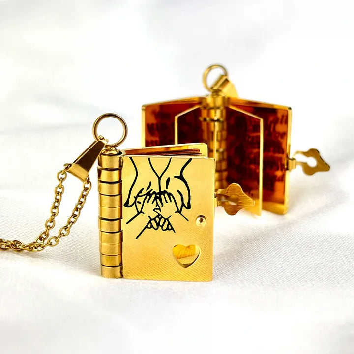Miniature book charm pendant in gold and silver with chain and matching tortoiseshell case