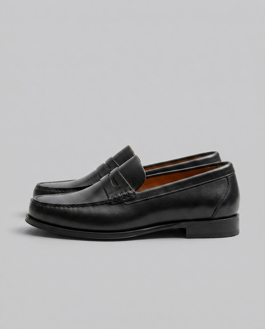 Men's slip-on penny loafers with moc-toe stitching and low heel
