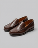 Men's slip-on penny loafers with moc-toe stitching and low heel