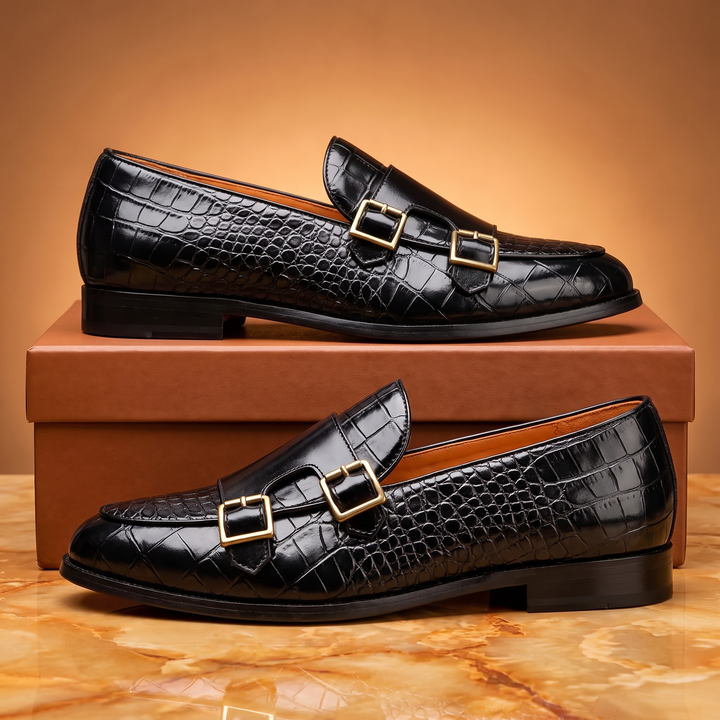 Embossed loafers with double buckle details and low heels
