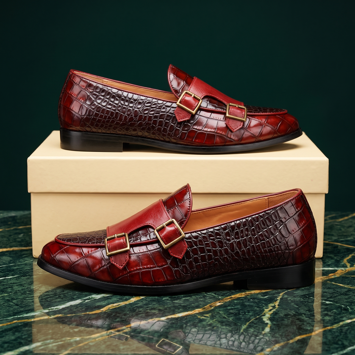 Embossed loafers with double buckle details and low heels
