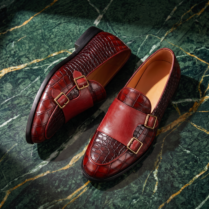 Embossed loafers with double buckle details and low heels