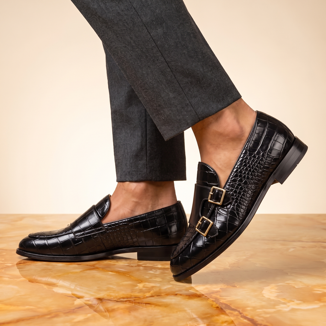 Embossed loafers with double buckle details and low heels
