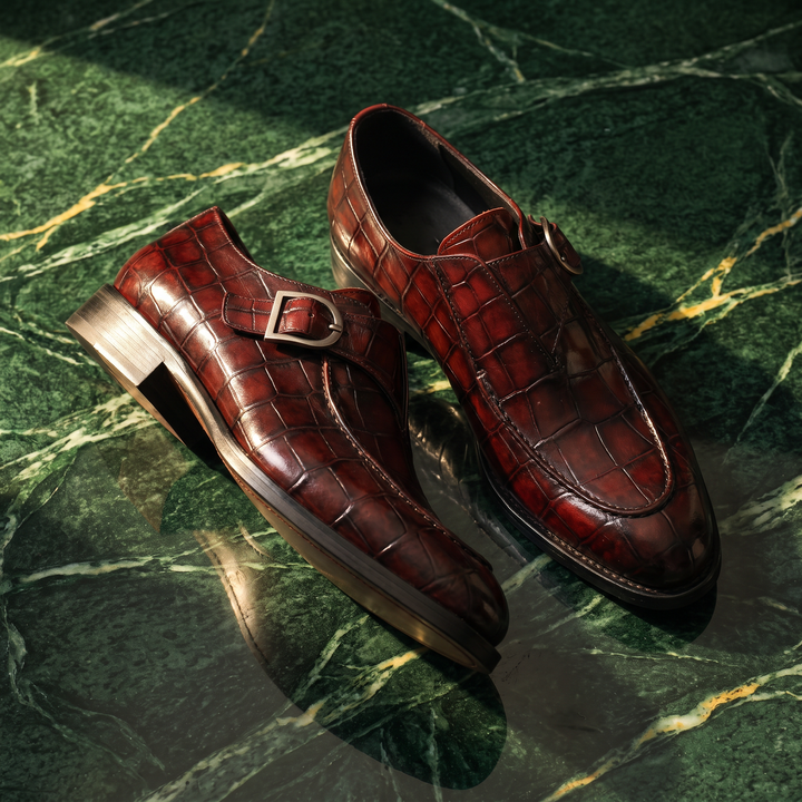 Men's glossy crocodile-effect loafers with buckle straps and low heels