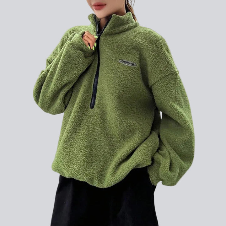 Women's textured quarter-zip sweatshirt with high collar, long sleeves and chest patch