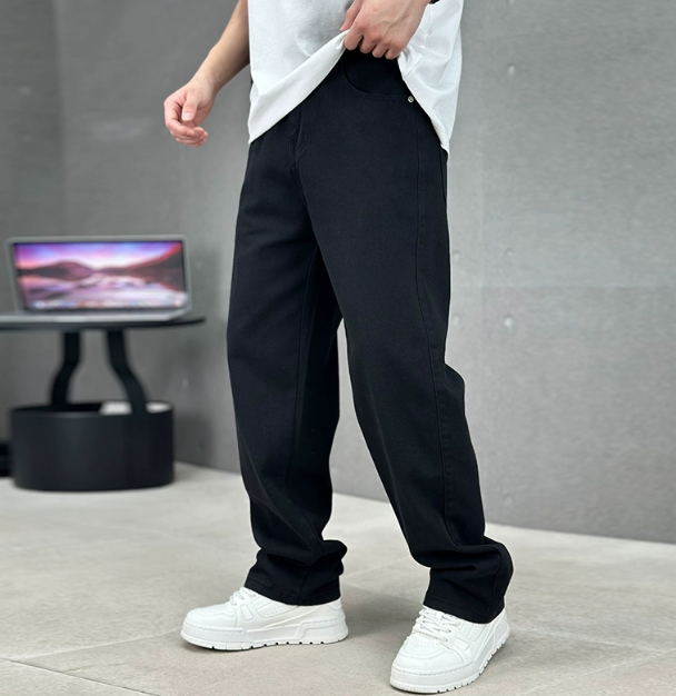 Men's relaxed straight-leg denim jeans shown with white trainers