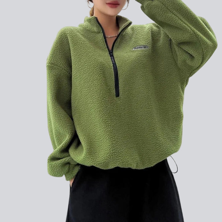 Women's textured quarter-zip sweatshirt with high collar, long sleeves and chest patch
