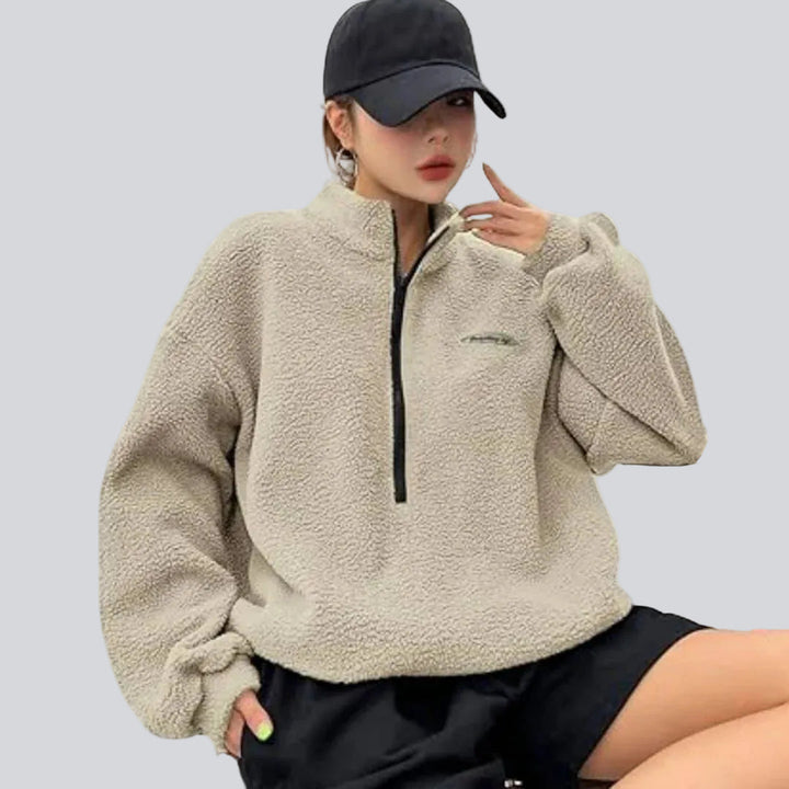 Women's textured quarter-zip sweatshirt with high collar, long sleeves and chest patch