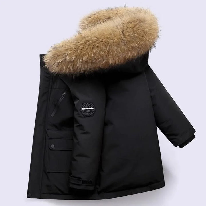 Boys' longline parka with fur-trimmed hood, zip fastening and flap pockets
