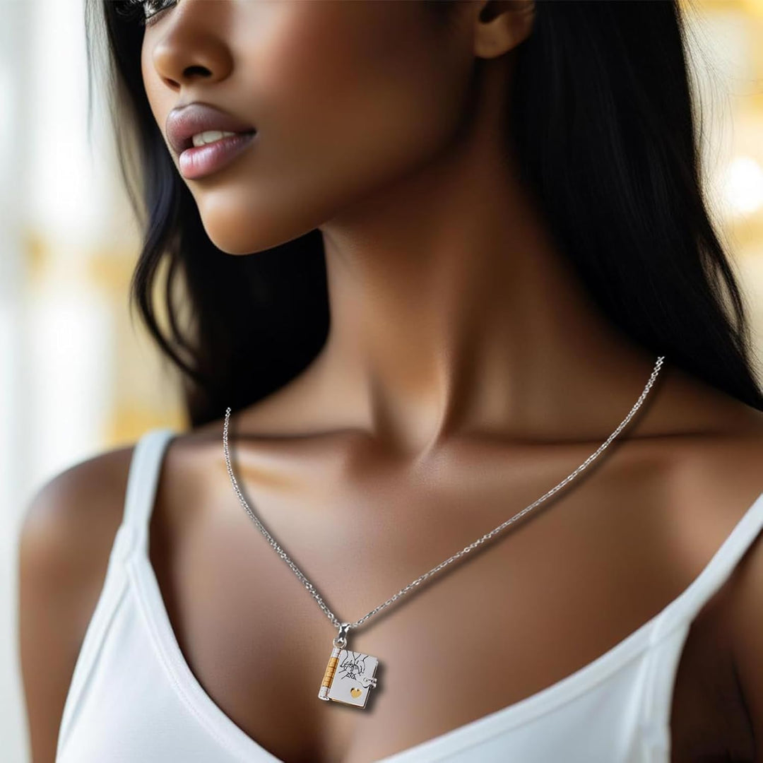 Miniature book charm pendant in gold and silver with chain and matching tortoiseshell case