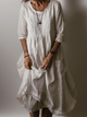 Women's flowing maxi dress with three-quarter sleeves and layered hem, scoop neckline