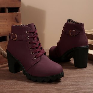 Women's black lace-up ankle boots with metal buckle strap and chunky block heel on platform sole