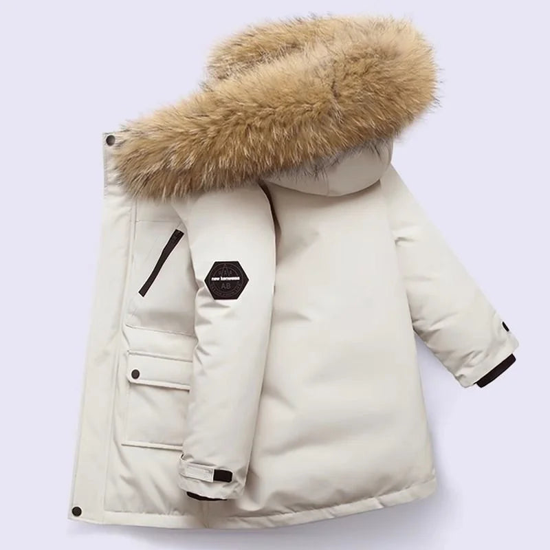 Boys' longline parka with fur-trimmed hood, zip fastening and flap pockets