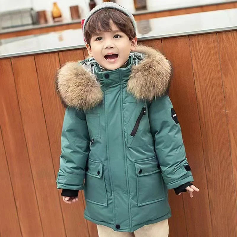Boys' longline parka with fur-trimmed hood, zip fastening and flap pockets