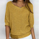Women's relaxed textured knit sweater with round neckline and three-quarter sleeves