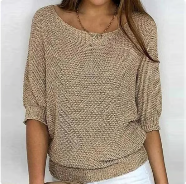 Women's relaxed textured knit sweater with round neckline and three-quarter sleeves