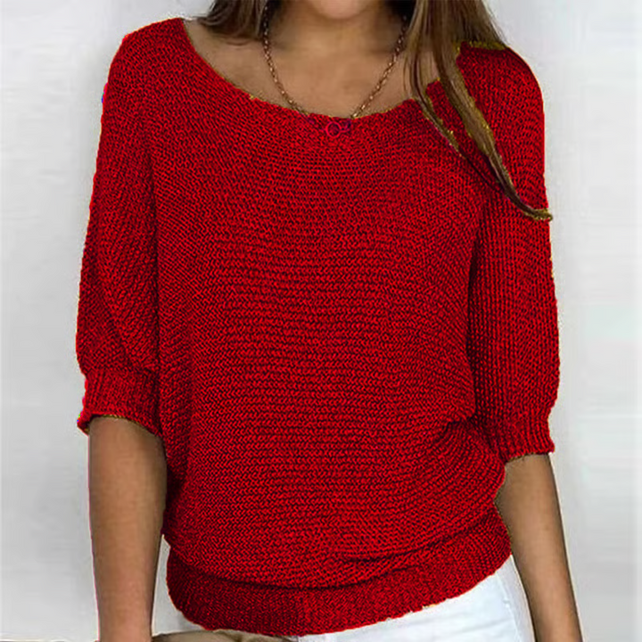 Women's relaxed textured knit sweater with round neckline and three-quarter sleeves