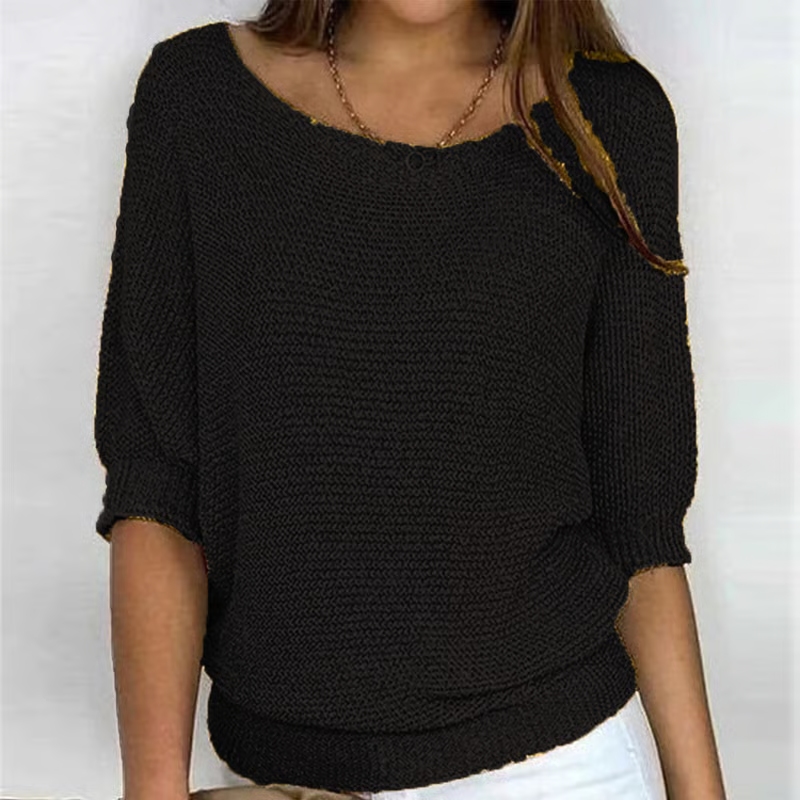 Women's relaxed textured knit sweater with round neckline and three-quarter sleeves
