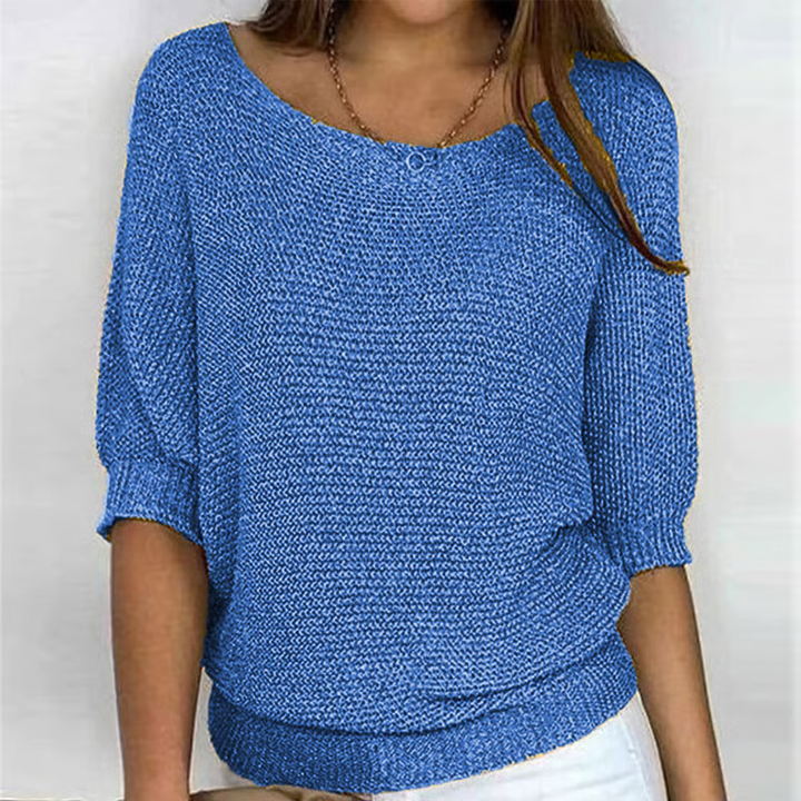 Women's relaxed textured knit sweater with round neckline and three-quarter sleeves