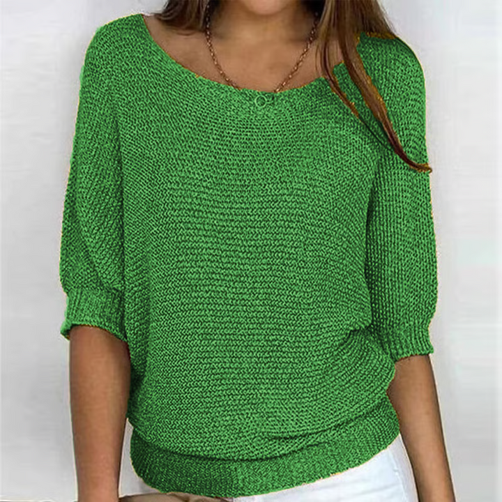 Women's relaxed textured knit sweater with round neckline and three-quarter sleeves