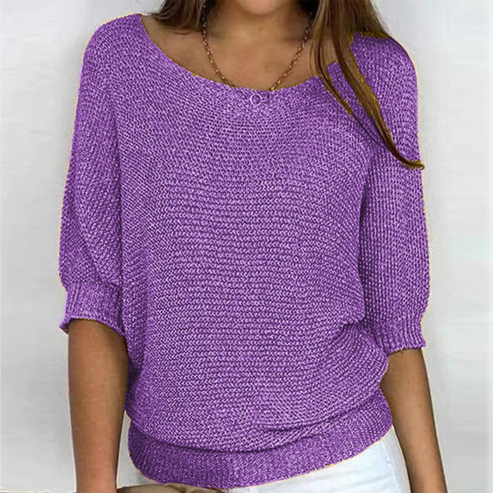 Women's relaxed textured knit sweater with round neckline and three-quarter sleeves