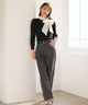 Women's black ribbed jumper with white collar and large ribbon bow
