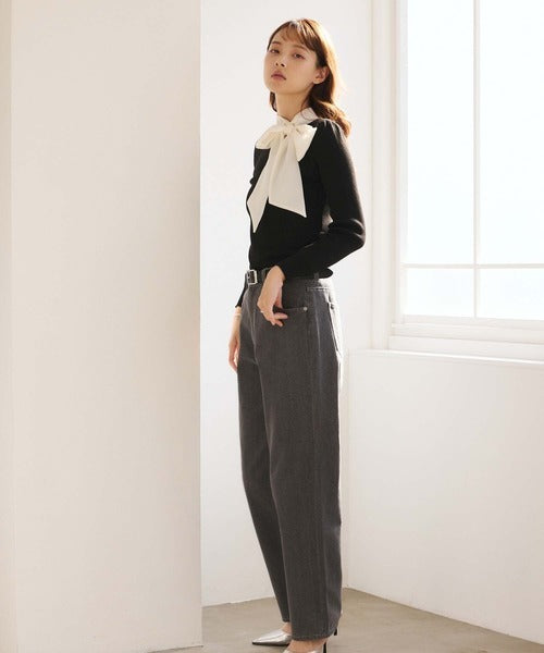 Women's black ribbed jumper with white collar and large ribbon bow