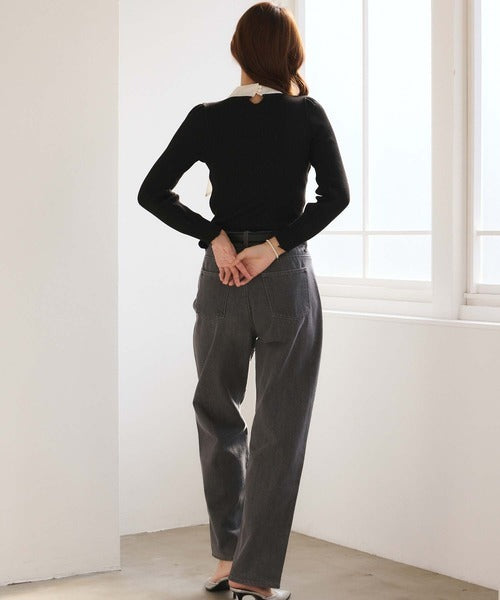 Women's black ribbed jumper with white collar and large ribbon bow