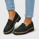 Women's black platform loafer with lug sole and padded band, shown on foot with jeans; also shown in pink with contrast sole and stitching