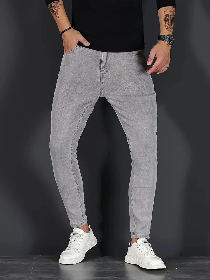Men's slim fit jeans with five-pocket design and tapered legs