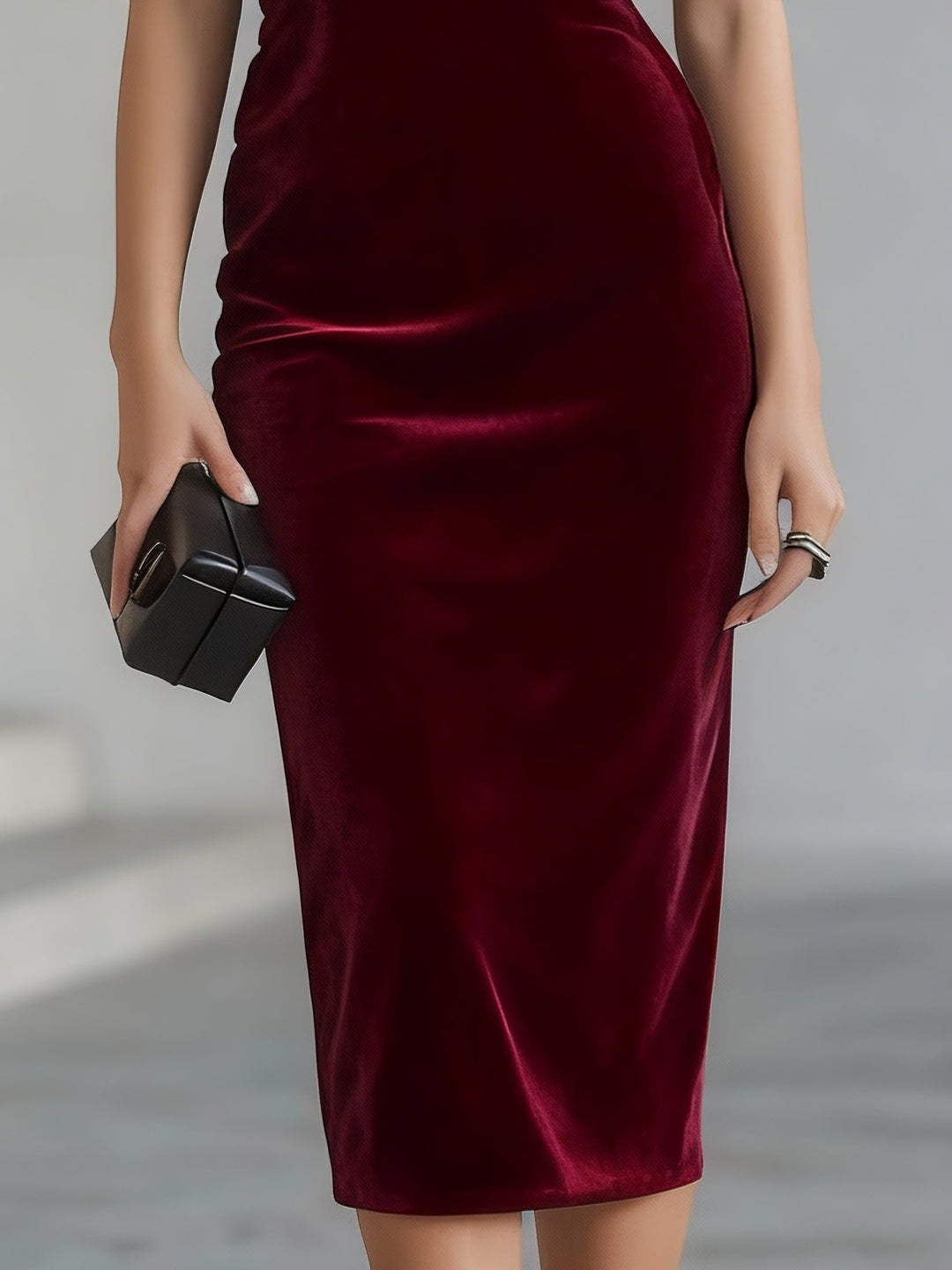 Women's burgundy velvet midi dress with oversized bow and sheer boat neckline