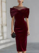 Women's burgundy velvet midi dress with oversized bow and sheer boat neckline