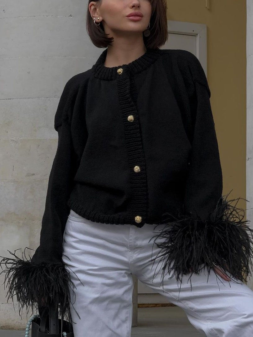 Women's cropped cardigan with feather-trimmed cuffs and button front