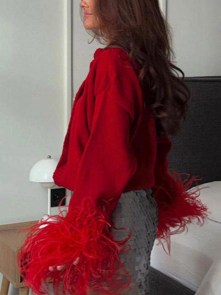 Women's cropped cardigan with feather-trimmed cuffs and button front