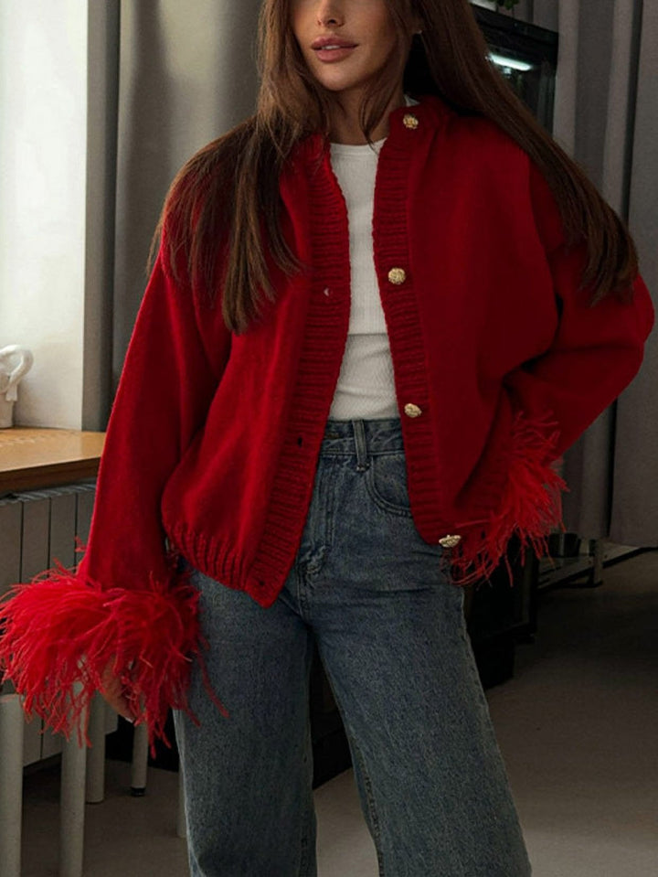 Women's cropped cardigan with feather-trimmed cuffs and button front