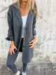 Women's long button-front coat with notched lapels and patch pockets