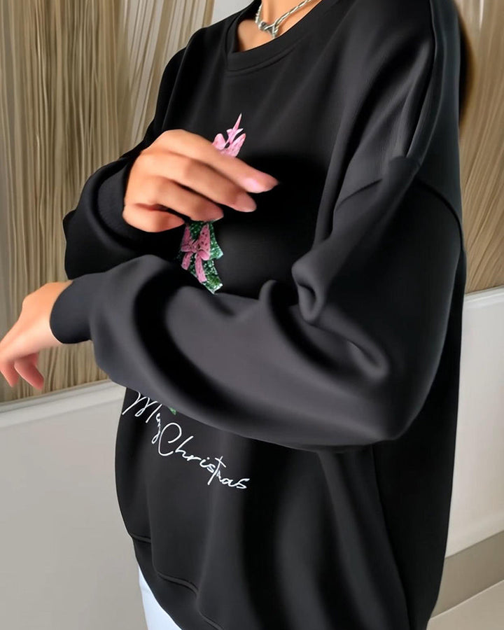 Women's long-sleeve Christmas sweatshirt with a Christmas tree and bow graphic