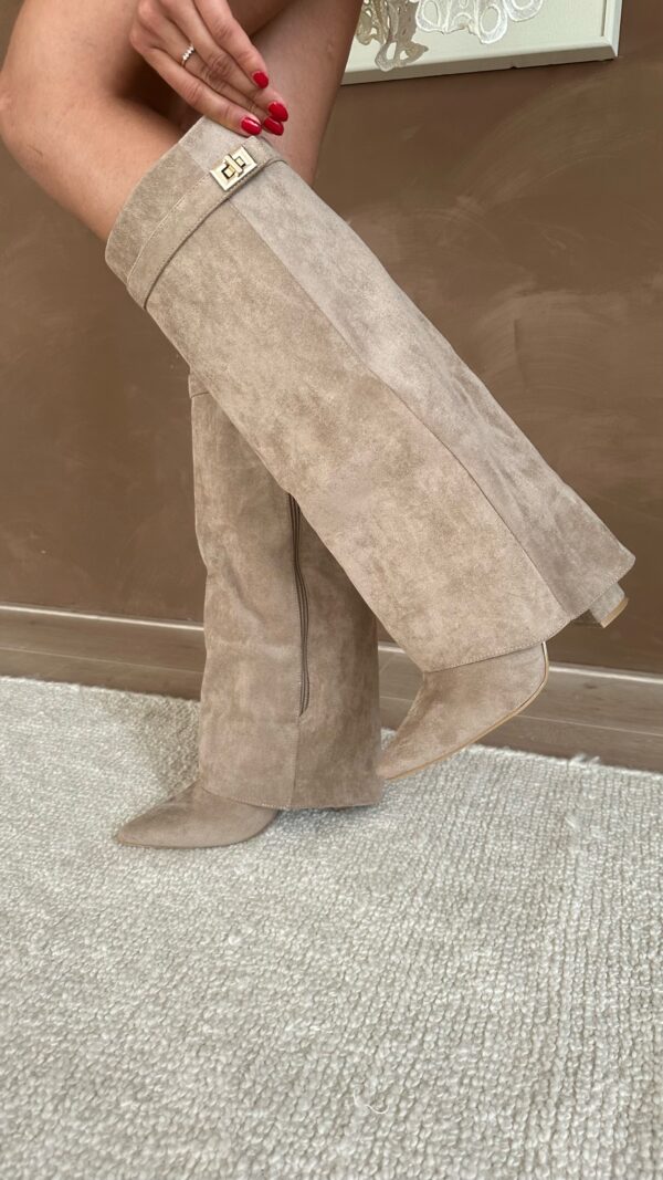Women's knee high pointed toe boots with block heels and buckle straps