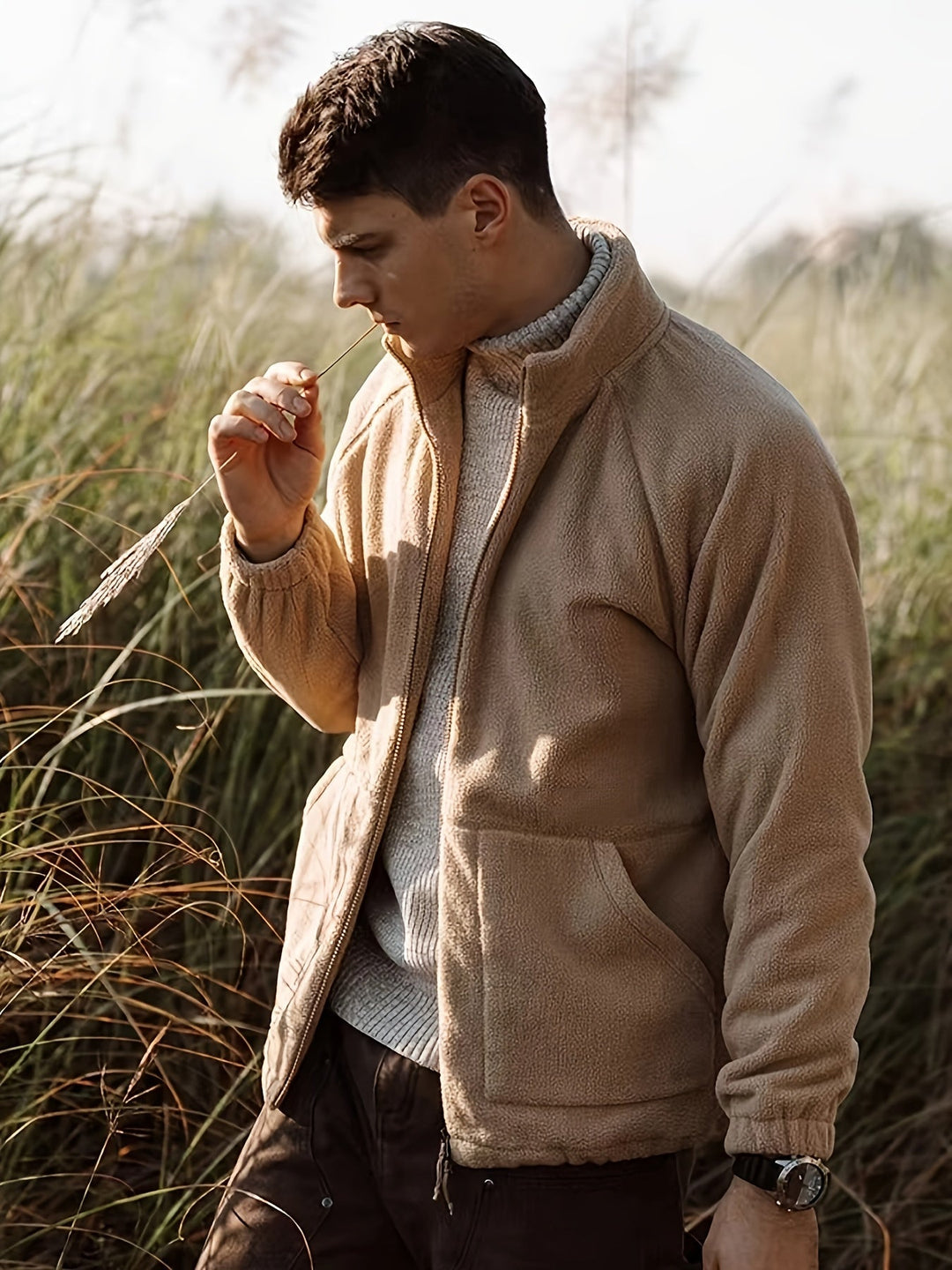 Men's beige fleece jacket with high collar, zip front and lower pockets