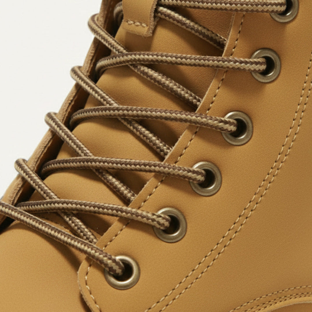 Men's ankle-height lace-up boots with padded collar, round toe and lug sole