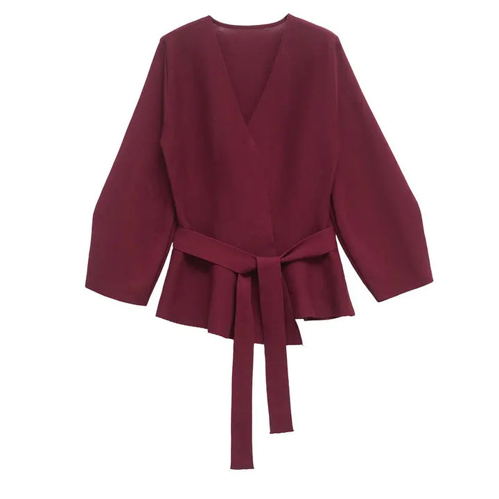 Women's wrap knit top with V-neckline, long sleeves and front tie waist